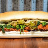 Chicken Italiano Sandwich · Homemade chicken cutlet, broccoli rabe, Jersey long hots and smoked mozzarella on a rustic r...