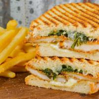 Chicken Milanese Panini · Homemade chicken cutlet, sauteed spinach, lemon mayo and provolone cheese on Italian bread p...