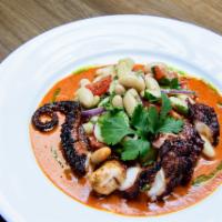Octopus · Grilled octopus, Mexican white bean salad and cascabel chile-cream sauce.