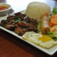 50. Marinated Grilled Chicken Rice Plate (Cơm Gà Pasteur) · Cơm Gà Pasteur. Marinated grilled chicken with a fried egg served over a bed of steamed rice...