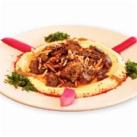 Hummus Special · Hummus topped with beef shawarma and chopped almonds.
Served with pita bread.