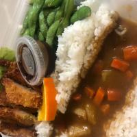 Chicken Katsu and Curry w/salad · Curry sauce over rice and chicken katsu. Comes with salad and edamame.