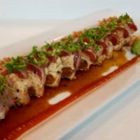Skinny Ninja · Spicy tuna & crab mix wrapped with soy paper, topped with peppered tuna, cilantro, jalapeno,...