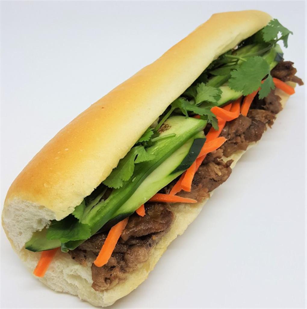 Grilled Pork Banh Mi · Grilled lemongrass pork, house mayo, pickled carrots, cucumber, jalapeno, pepper, and cilantro.