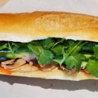 Grilled Chicken Banh Mi · Grilled lemongrass chicken, house mayo, pickled carrots, cucumber, jalapeno, pepper, and cil...