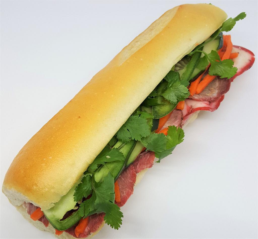 Cured Pork Banh Mi · Vietnamese style 3 layer ham, house mayo, pickled carrots, cucumber, jalapeno, pepper, and cilantro.