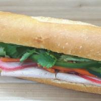 Pork Roll Banh Mi · Lean pork meat roll, house mayo, Pâté spread, pickled carrots, cucumber, jalapeno, pepper, a...