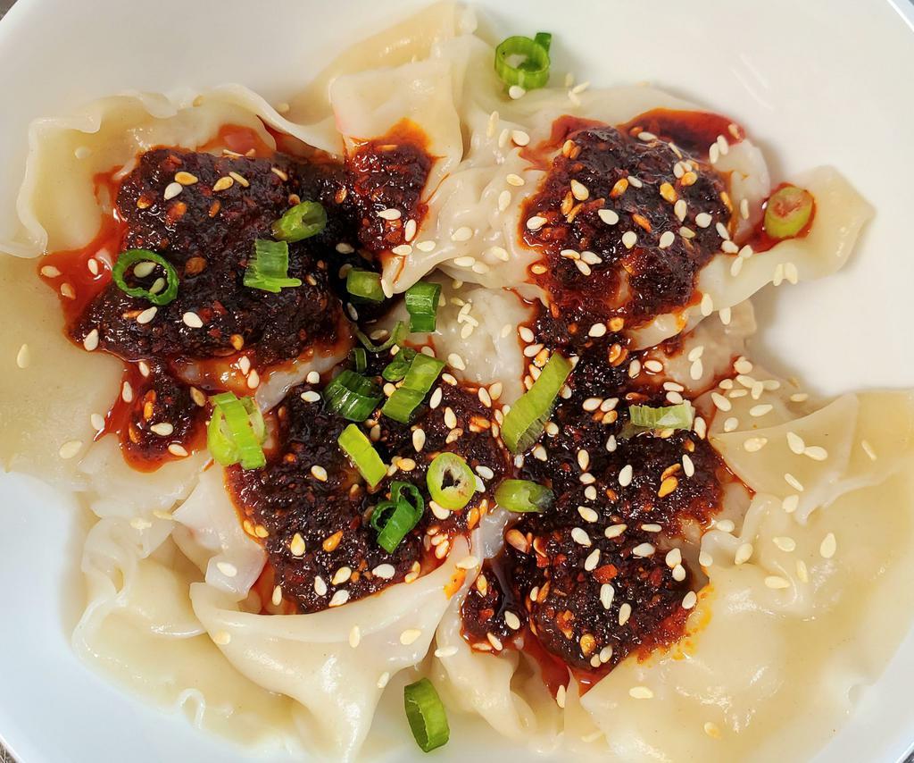 Chili Oil Wontons ·  House-made 7 pork dumplings drizzle with house-made chili oil. This dish does has a bit of a kick to it, but not too spicy.