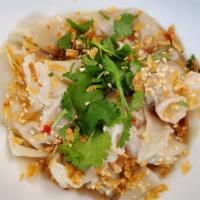Sweet & Tangy Wontons · Pork wontons drizzle with house-made sweet & tangy sauce, fried onion bits, sesame seeds and...