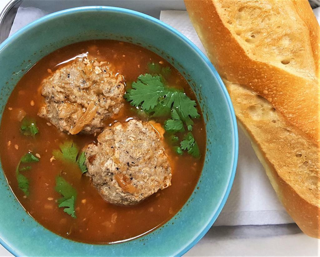 Pork Meatball Soup with Bread · Comes with bread. Vietnamese marinated pork meatballs in tomato soup base. Served with bread.