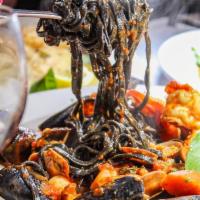 Black linguini Pescatore · Black ink linguini served with mix seafood in a touch of Red Sauce.