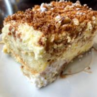 Toasted Almond Cake · Two layers of Lady fingers and mascarpone cream, topped with toasted almond and amaretto cru...