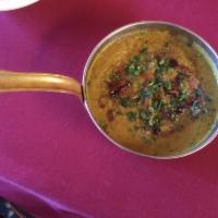 Tadke Wali Daal (gluten free) · Yellow lentils cooked with chopped onion, tomato and spices and then tempered with flavorful...