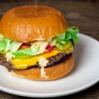 Doc's Classic Cheeseburger · 1/4 lb patty, American cheese, secret sauce, tomato, lettuce, onion, pickles