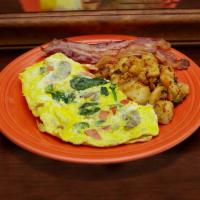 Garden Omelette on Plate · Green peppers, onions, mushrooms and tomatoes. Served with home fries and toast.