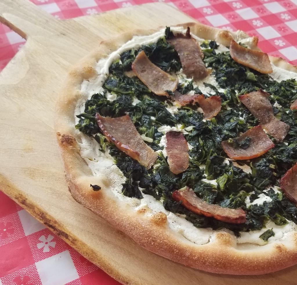 Ricotta Pizza · Comes with spinach, caramelized onions and sausage.