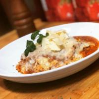 Lasagna · Layers of pasta with fresh ground beef, ricotta, Parmesan and mozzarella cheeses in our own ...