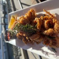 Rosemary Calamari · Comes with cocktail sauce, remoulade, lemon wedges.