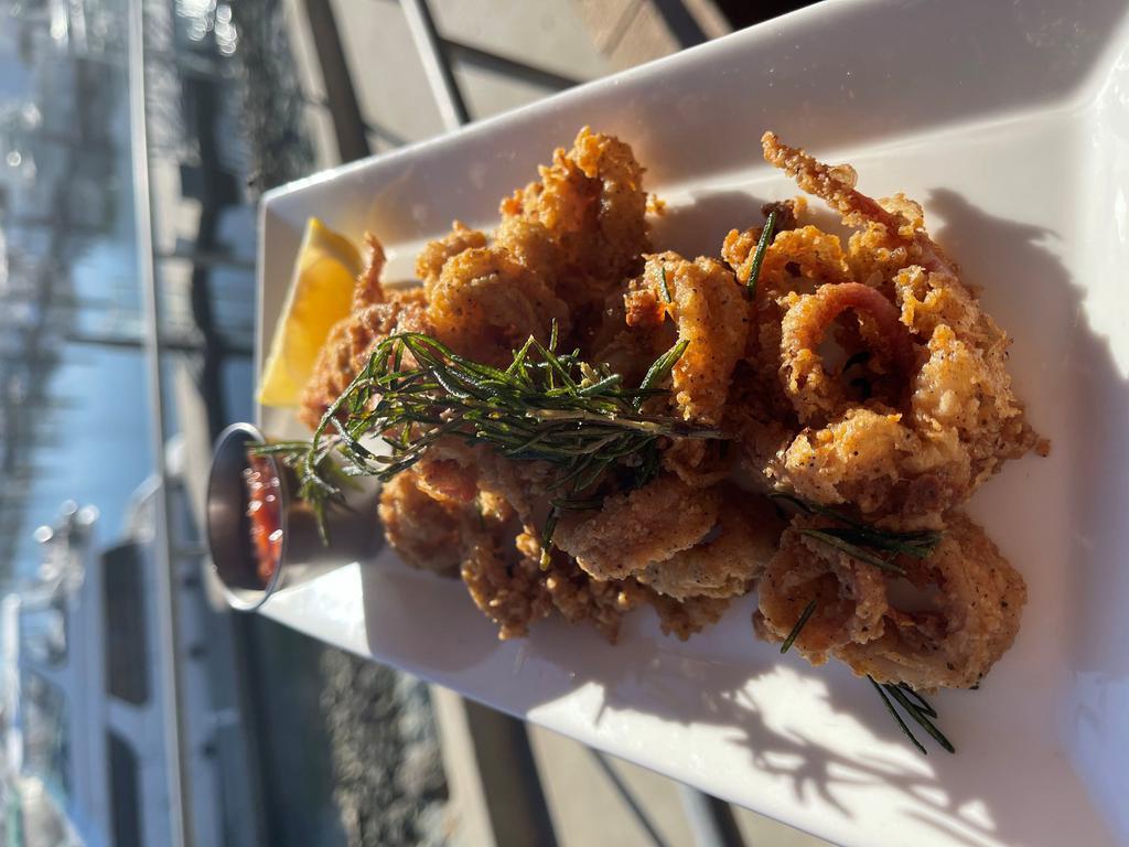 Rosemary Calamari · Comes with cocktail sauce, remoulade, lemon wedges.