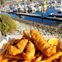 Beer Battered Fish and Chips  · Beer battered Alaskan cod, French fries, tarter sauce and a lemon wedge.