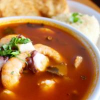 Marinera Soup · Served with a plentiful mix of shrimp, octopus, calamari, snail, oyster, and fish. Served wi...
