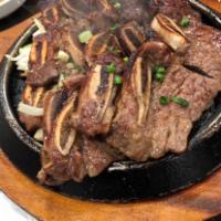 1. La Beef Short Ribs · Prime angus. Marinated beef short ribs in a special house sauce.
