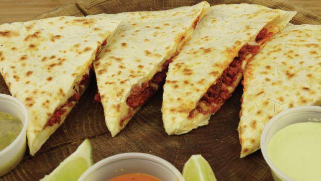 Quesadilla · Giant Flour Tortilla with melted cheese and your choice of meat.