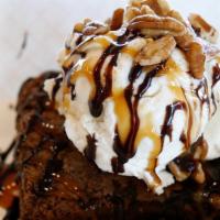 Warm Fudge Brownie Sundae · Warmed fudge brownie with premium vanilla bean ice cream, topped with caramel and chocolate ...