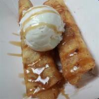 Caramel Apple Flautas (2) · Two flautas stuffed with apples fried crisp and rolled in cinnamon sugar, topped with premiu...