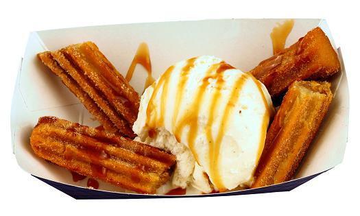 Caramel Churros · Crispy fried caramel filled churros tossed in cinnamon sugar topped with premium Vanilla bean ice cream and caramel.