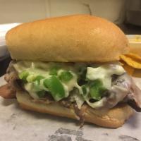 B.W. Philly · Thinly sliced roast beef combined with fresh green peppers, white onion, spices and topped w...