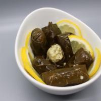 Grape Leave Dolma · in house hand rolled with fresh herbs. Vegetarian