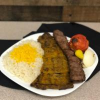 Beef Soltani Kabob · Skewers of charbroiled ground beef & flat marinated filet mignon sitting on top of white bas...
