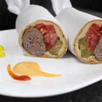 Ground Beef Sandwich · Charbroiled ground beef kabob made into an amazing sandwich with pickles, tomatoes, parsley ...