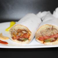 Beef Tongue Sandwich · Our slow cooked beef tongue chopped into bite size pieces into a sandwich full of fried onio...
