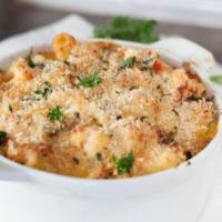 Lobster Macaroni and Cheese · Chef’s blend of cheeses combined with fresh ballerina pasta topped with lobster and bread cr...