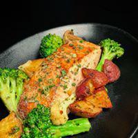 Grilled Atlantic Salmon · Prepared with our signature garlic pepper seasoning and grilled with roasted potatoes and fr...
