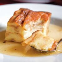 Bread Pudding · Made fresh daily and smothered in hot cognac sauce.