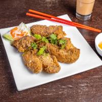 A6. Canh Ga Chien Bo · Fried chicken wing. 8 wings.