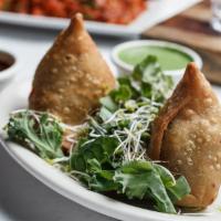 Vegetable Samosa · Crispy pastry stuffed with potato and peas served with mint and imli chutney. Vegetarian