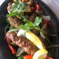 Seenkh Kebab · Ground lamb sausage served on sizzler.