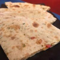 Mixed Veggie Paratha · Layered wheat bread stuffed with mixed vegetables.