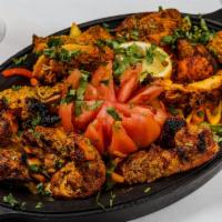 Chicken Tikka · Boneless piece of chicken marinated with spices and herbs and roasted in the tandoor.