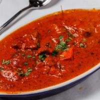 Paneer Tikka Masala · Roasted paneer cheese cooked with bell peppers in a butter cream sauce.