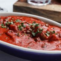 Alu Matter Makhani · Green peas and potatoes in a tomato butter sauce.