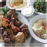 Family Meal · 3 skewers of kabobs, kafta, chicken, filet mignon on a bed of rice served with hummus, baba ...