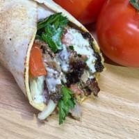Tri Tip Shawarma Beef Sandwich · Marinated and flame broiled USDA choice tri tip, tomatoes, fresh chopped parsley, onions, pi...