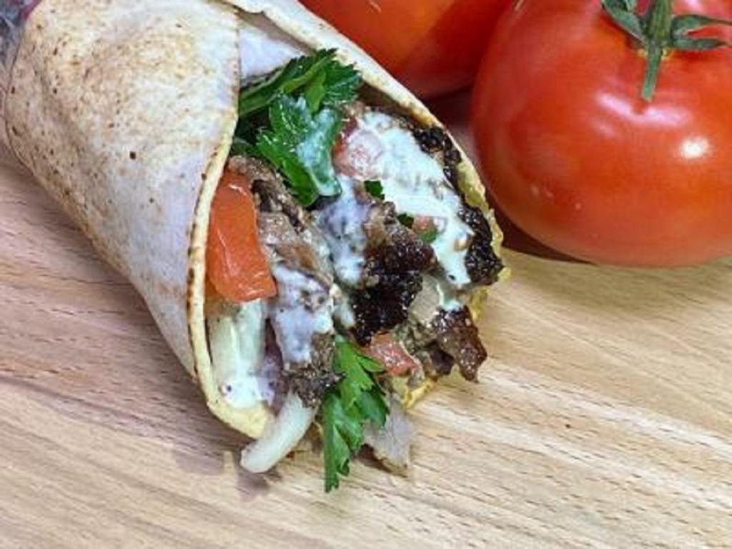 Tri Tip Shawarma Beef Sandwich · Marinated and flame broiled USDA choice tri tip, tomatoes, fresh chopped parsley, onions, pickles and tahini sauce.