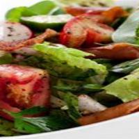 Fattoush Salad · Romaine lettuce, chopped parsley, onions, cucumber, radish and sumac, tossed in fresh lemon ...