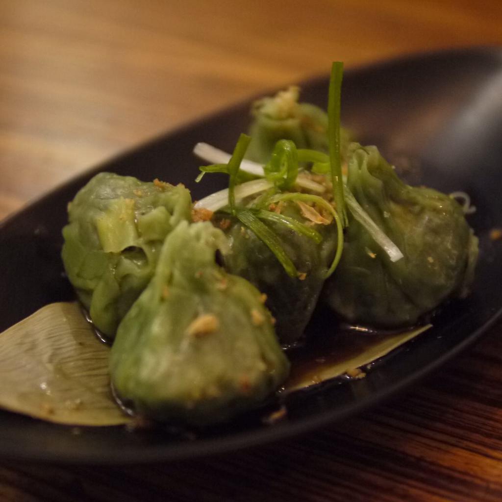 Vegetable Dumplings · Spinach and mixed vegetables. Served with house black bean mushroom sauce.